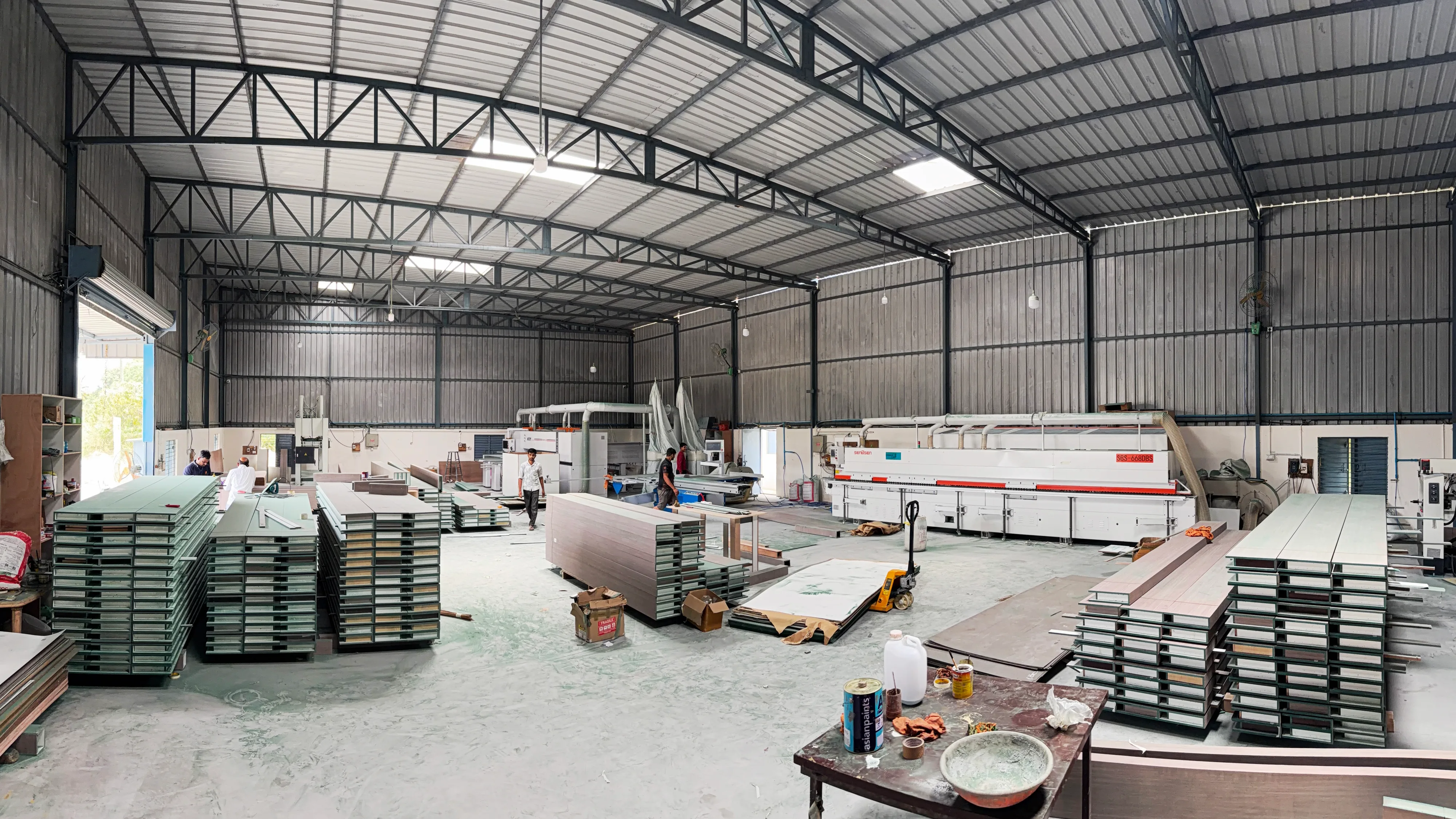 Velmont manufacturing facility — full production floor with panel processing machinery