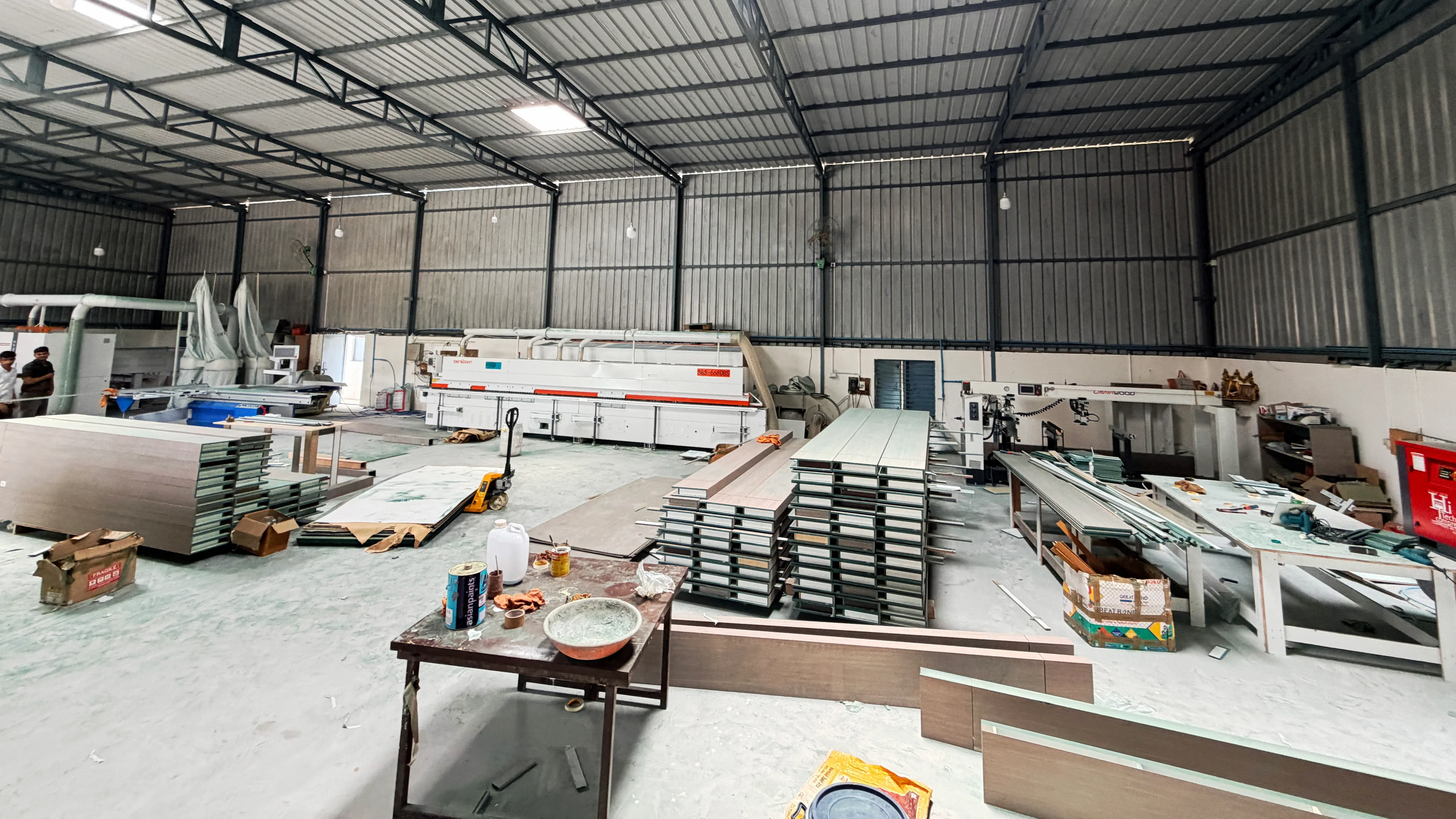 Velmont manufacturing facility — production floor with finished panel stacks awaiting dispatch