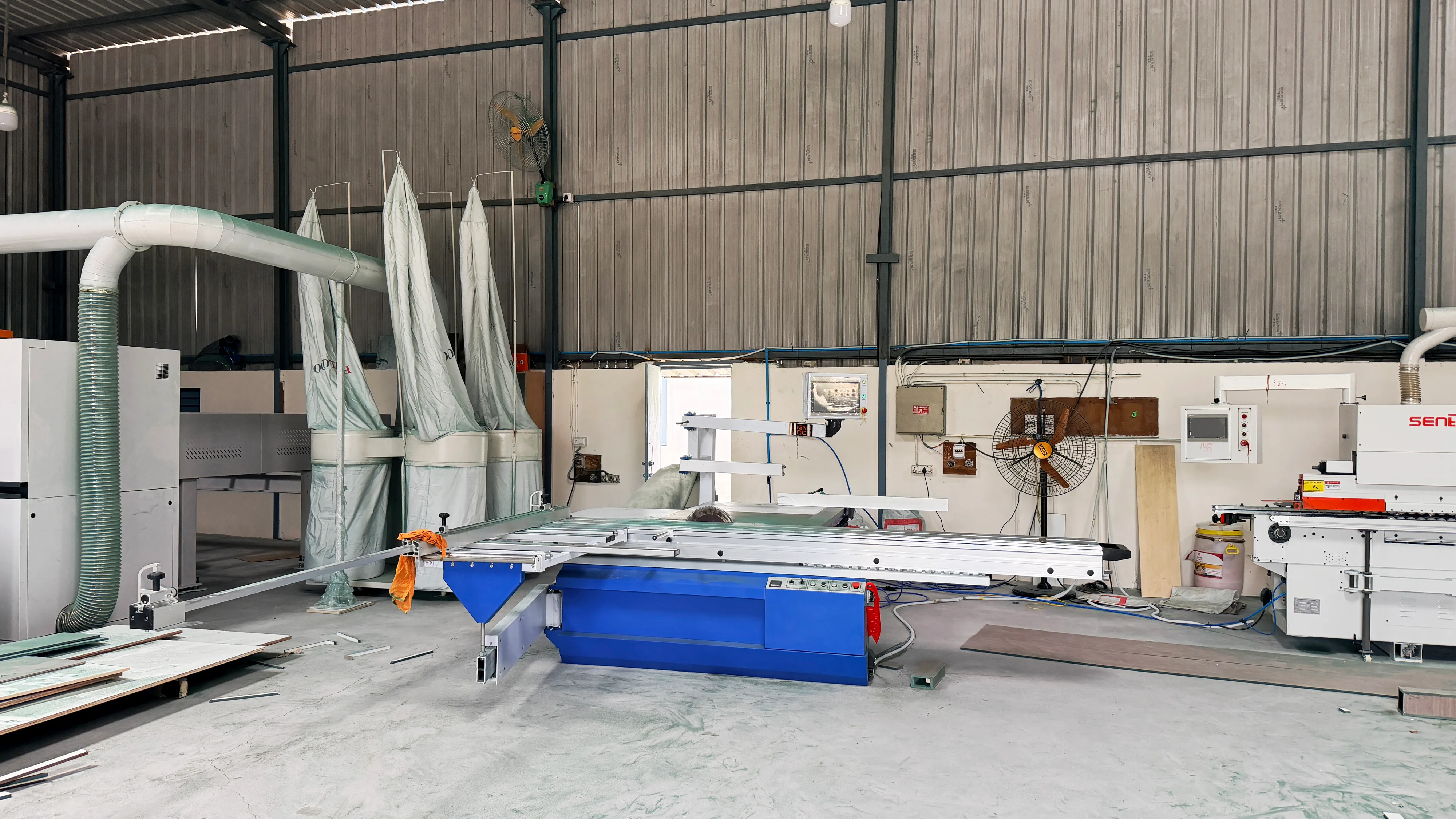 Velmont manufacturing facility — precision sliding table saw station